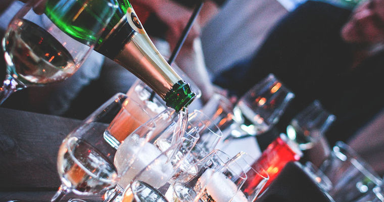 pouring a bottle of champagne